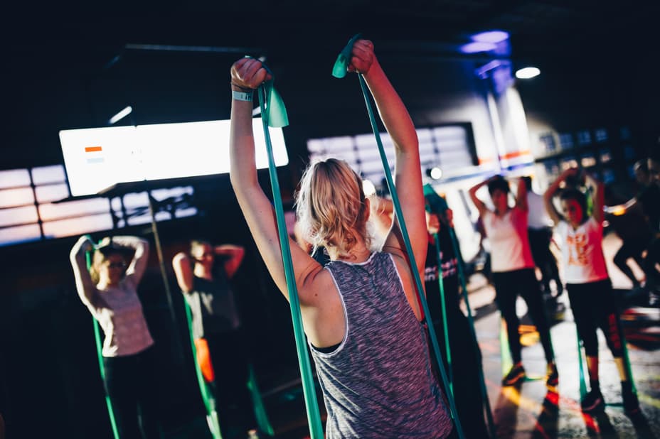 A woman leading a group exercise class.