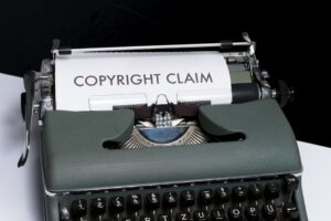 A typewriter with the words copyright claim.
