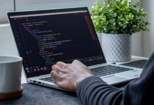 A website being coded on a laptop.